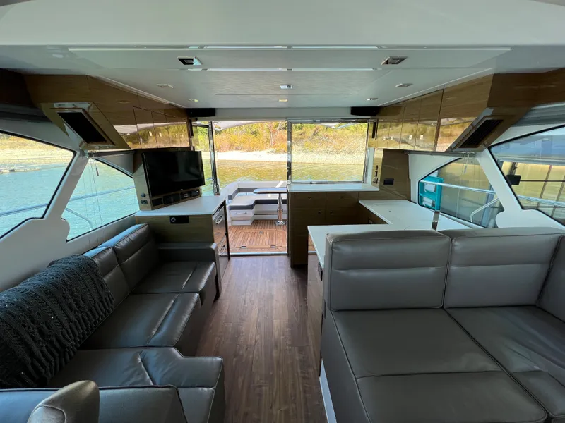 Slide: The Image of Luxurious interior of 2018 Cruisers Yachts 50 Cantius with modern furnishings and scenic view. - 17