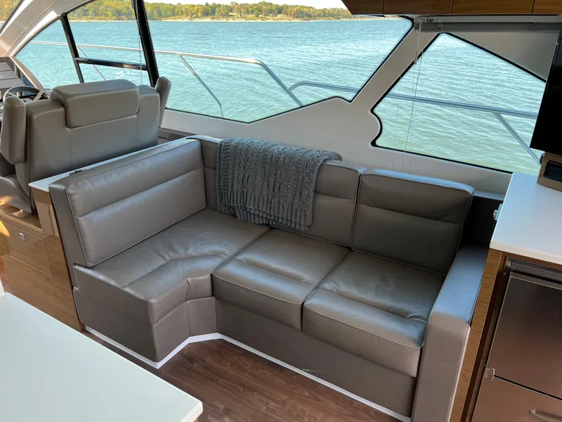 Slide: The Image of Luxurious interior of 2018 Cruisers Yachts 50 Cantius with leather seating and scenic water view. - 20