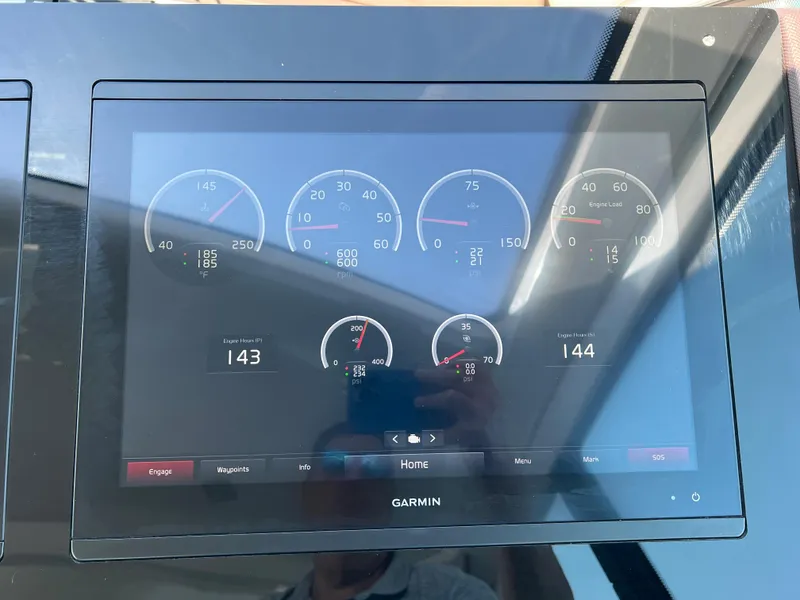 Slide: The Image of 2018 Cruisers Yachts 50 Cantius Garmin dashboard display showing engine metrics. - 27