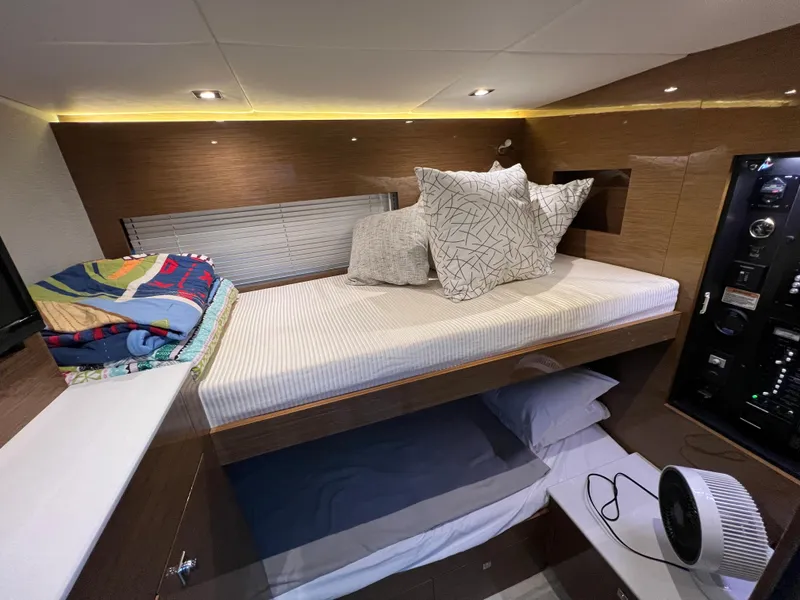 Slide: The Image of 2018 Cruisers Yachts 50 Cantius cabin with bunk beds and modern decor. - 28
