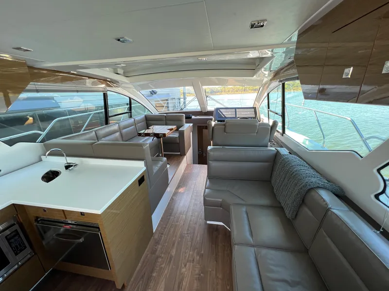 Slide: The Image of 2018 Cruisers Yachts 50 Cantius interior with modern kitchen and spacious seating. - 30