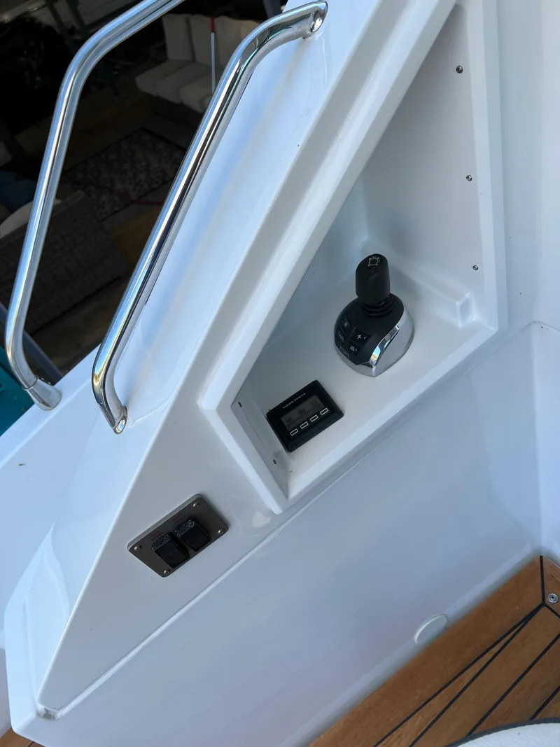 Slide: The Image of Control panel of 2018 Cruisers Yachts 50 Cantius with joystick and digital display. - 31