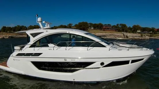 Slide: The Image of 2018 Cruisers Yachts 50 Cantius luxury motor yacht cruising on water. - 4