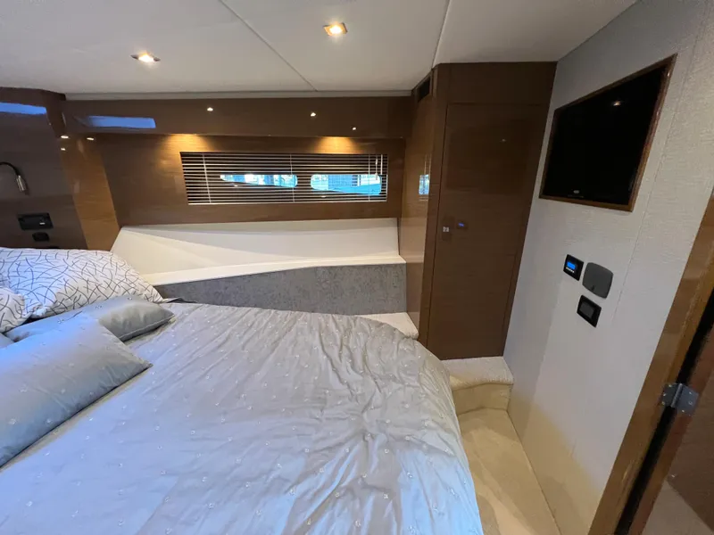 Slide: The Image of 2018 Cruisers Yachts 50 Cantius bedroom with modern decor and a wall-mounted TV. - 42