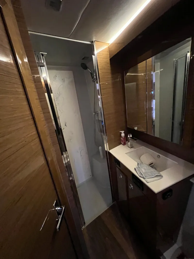Slide: The Image of 2018 Cruisers Yachts 50 Cantius bathroom with modern fixtures and wooden cabinetry. - 46