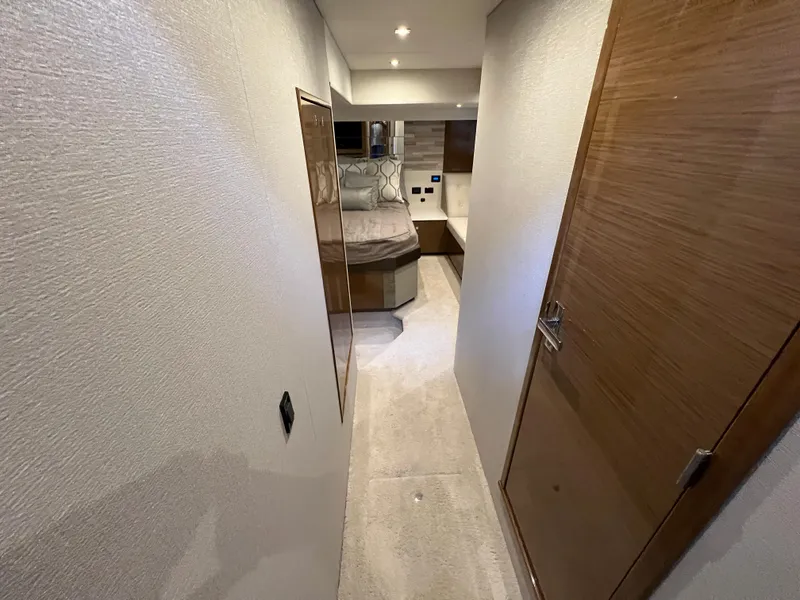 Slide: The Image of Hallway leading to a cozy bedroom in a 2018 Cruisers Yachts 50 Cantius. - 49