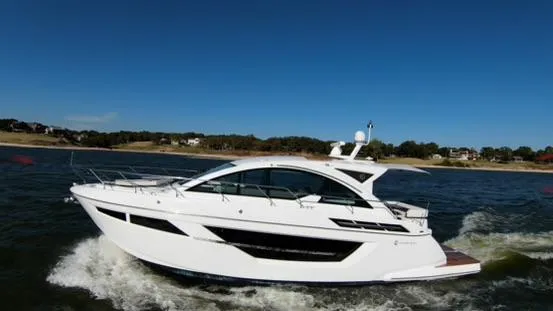 Slide: The Image of 2018 Cruisers Yachts 50 Cantius luxury yacht cruising on open water. - 8