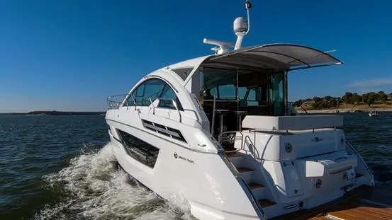 Slide: The Image of 2018 Cruisers Yachts 50 Cantius luxury yacht cruising on open water. - 9