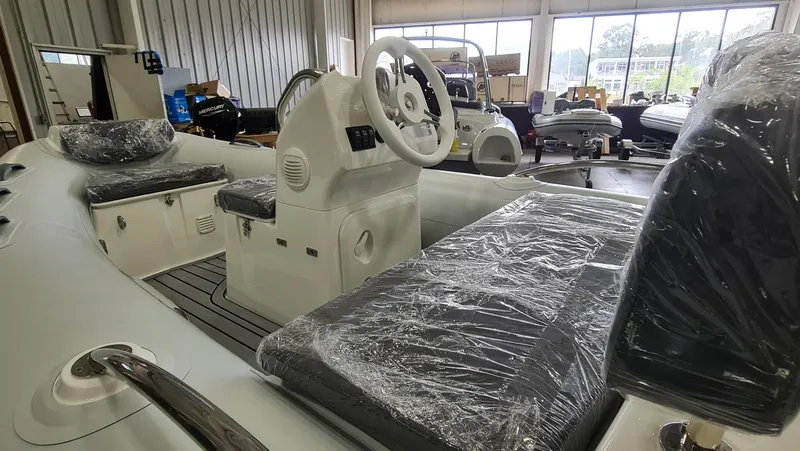 Slide: The Image of 2023 Grand Inflatables G380HLF boat interior in showroom. - 9