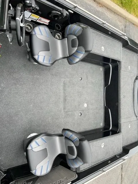 Slide: The Image of 2023 Nitro ZV21 Pro boat interior with dual seats and spacious deck. - 6
