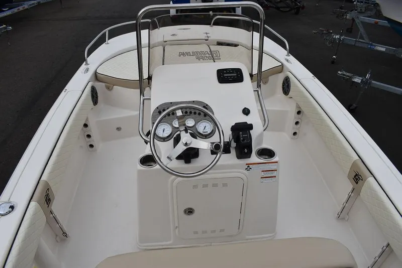 Slide: The Image of 2022 Carolina Skiff 19 Ultra Elite boat interior with steering console and seating. - 11