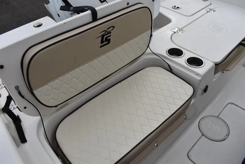 Slide: The Image of 2022 Carolina Skiff 19 Ultra Elite boat seat with beige diamond-pattern upholstery. - 14