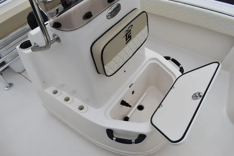 Slide: The Image of 2022 Carolina Skiff 19 Ultra Elite boat storage compartment with open hatch. - 23