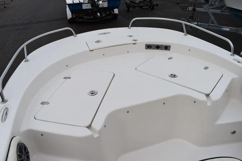 Slide: The Image of 2022 Carolina Skiff 19 Ultra Elite boat deck with storage compartments. - 24