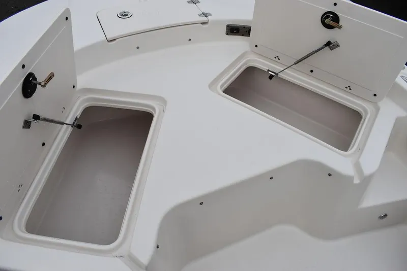Slide: The Image of 2022 Carolina Skiff 19 Ultra Elite boat storage compartments. - 25