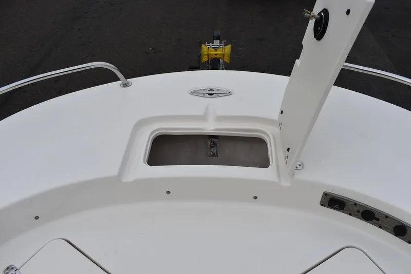 Slide: The Image of 2022 Carolina Skiff 19 Ultra Elite boat deck with open storage compartment. - 26