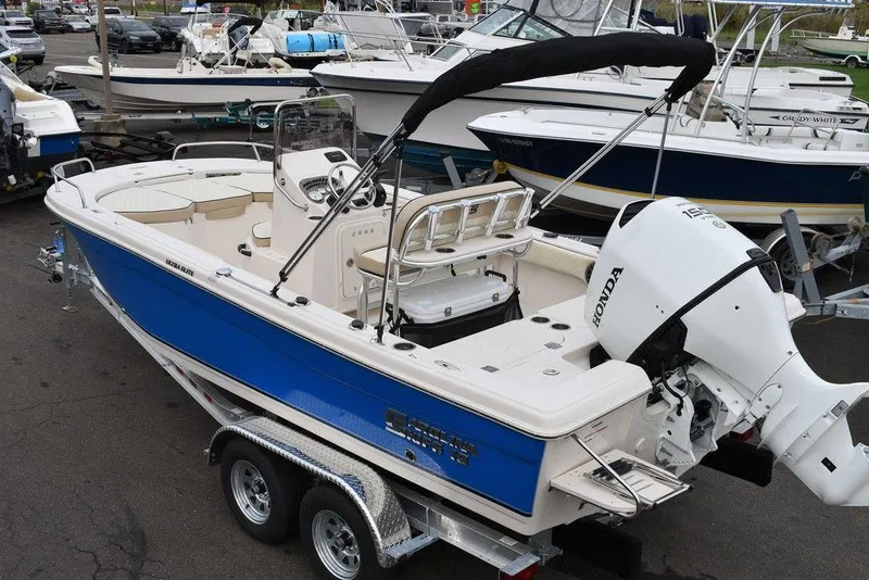 Slide: The Image of 2022 Carolina Skiff 19 Ultra Elite boat with Honda outboard motor on trailer. - 3