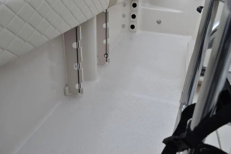 Slide: The Image of 2022 Carolina Skiff 19 Ultra Elite interior detail with seating and storage features. - 30