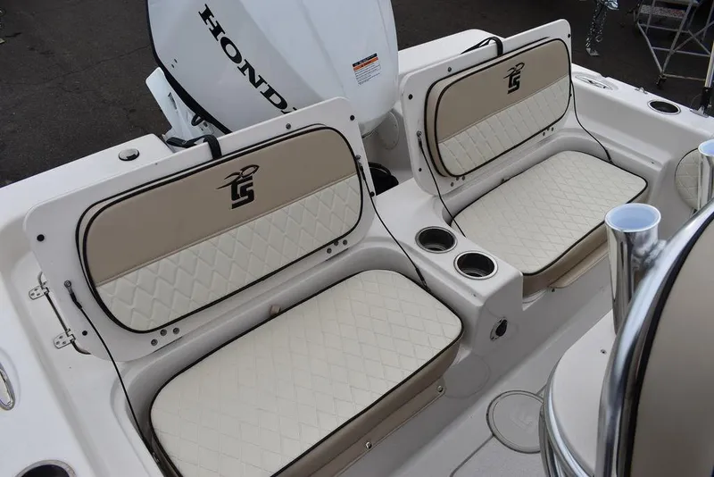 Slide: The Image of 2022 Carolina Skiff 19 Ultra Elite boat seats with Honda engine in background. - 32