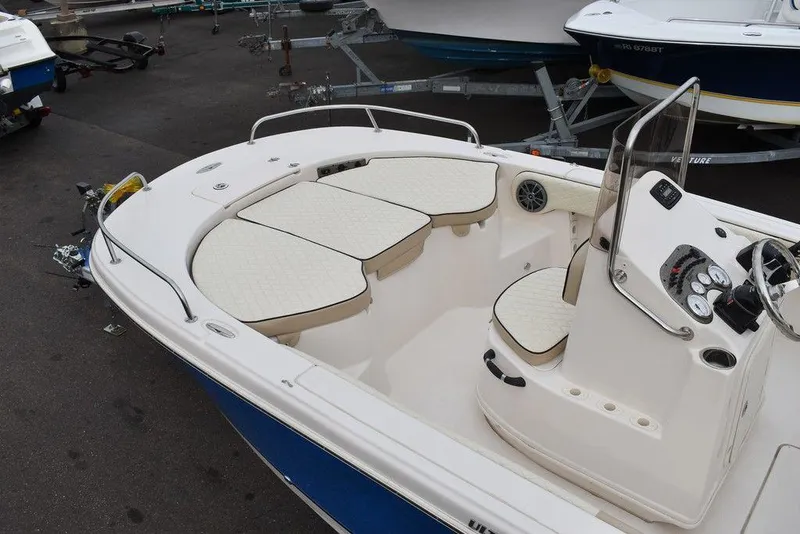 Slide: The Image of 2022 Carolina Skiff 19 Ultra Elite boat interior with seating and console. - 6