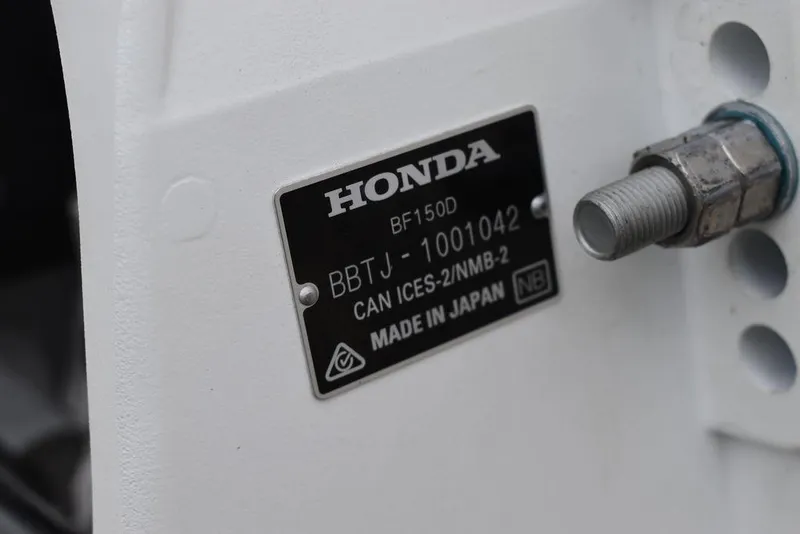 Slide: The Image of Honda engine label on a 2022 Carolina Skiff 19 Ultra Elite boat. - 7