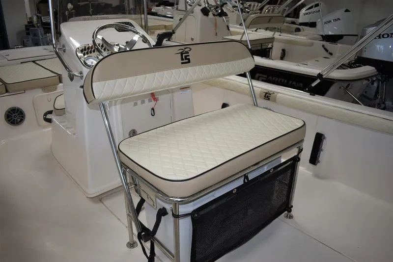Slide: The Image of 2023 Carolina Skiff 19 LS boat interior with cushioned seating and steering console. - 15