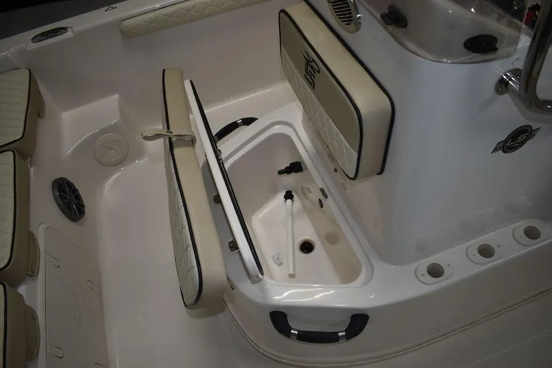 Slide: The Image of 2023 Carolina Skiff 19 LS boat interior with storage compartment and seating. - 17