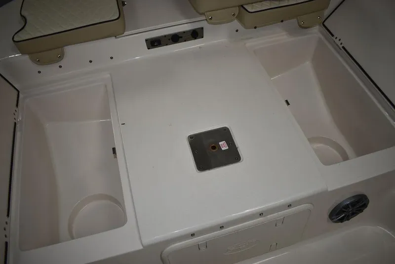 Slide: The Image of 2023 Carolina Skiff 19 LS boat interior with storage compartments and seating. - 20