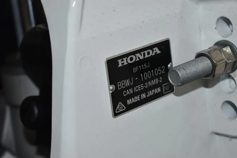 Slide: The Image of Honda engine plate on a 2023 Carolina Skiff 19 LS, made in Japan. - 25