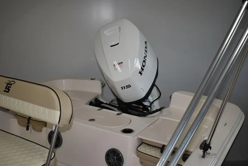 Slide: The Image of 2023 Carolina Skiff 19 LS boat with Honda 115 outboard motor, beige seating. - 3