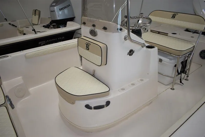 Slide: The Image of 2023 Carolina Skiff 19 LS boat interior with seating and console. - 6