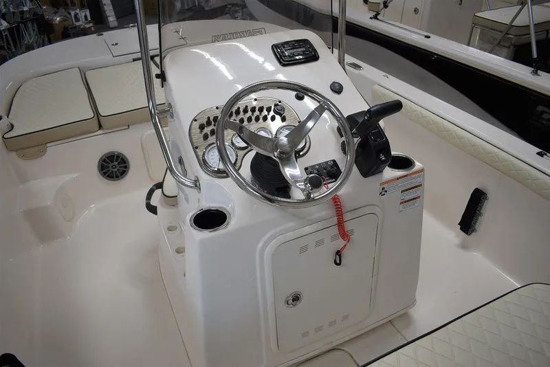 Slide: The Image of 2023 Carolina Skiff 19 LS boat console with steering wheel and controls. - 7