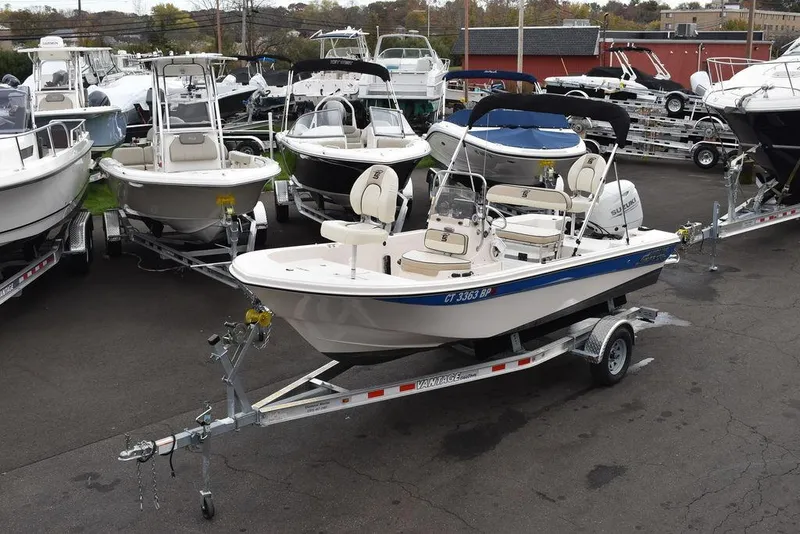 Slide: The Image of 2023 Carolina Skiff 178 JLS boat on trailer in a dealership lot. - 1