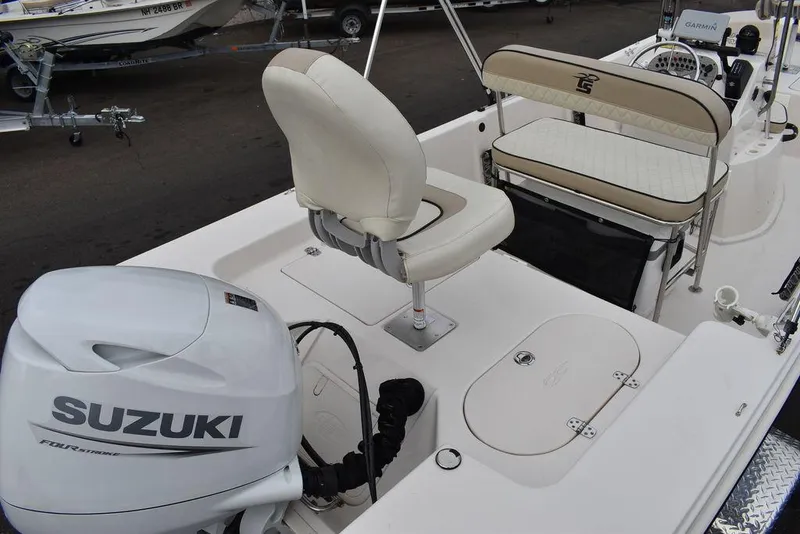 Slide: The Image of 2023 Carolina Skiff 178 JLS boat with Suzuki outboard motor and seating. - 10