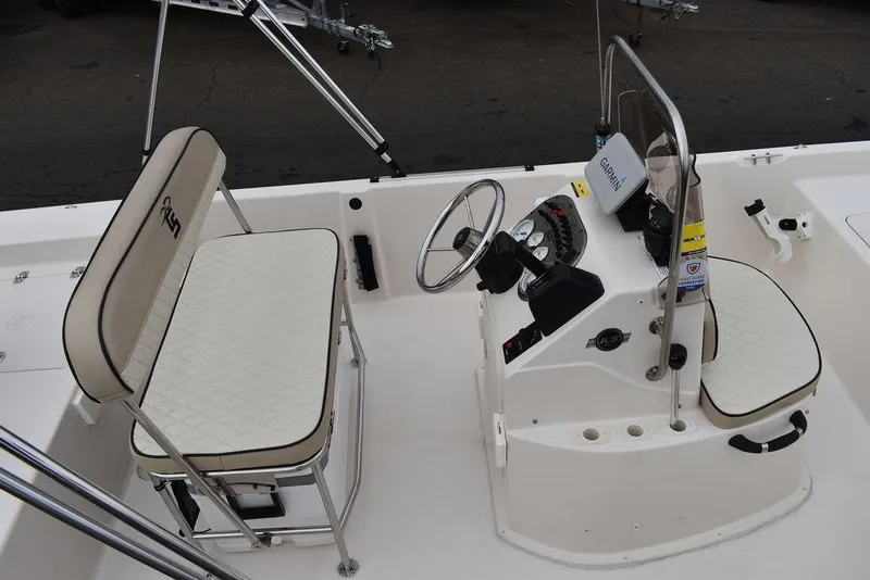 Slide: The Image of 2023 Carolina Skiff 178 JLS boat interior with steering console and seating. - 12