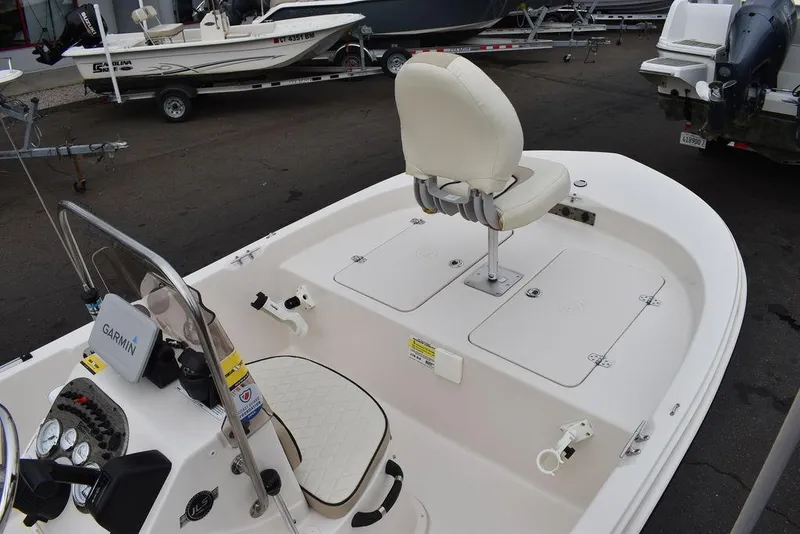 Slide: The Image of 2023 Carolina Skiff 178 JLS boat interior with seating and storage compartments. - 13