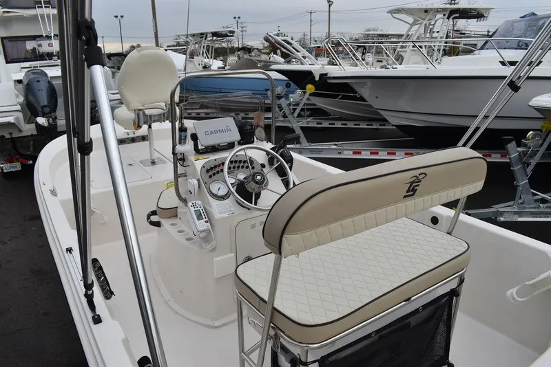 Slide: The Image of 2023 Carolina Skiff 178 JLS boat interior with steering console and seating. - 18