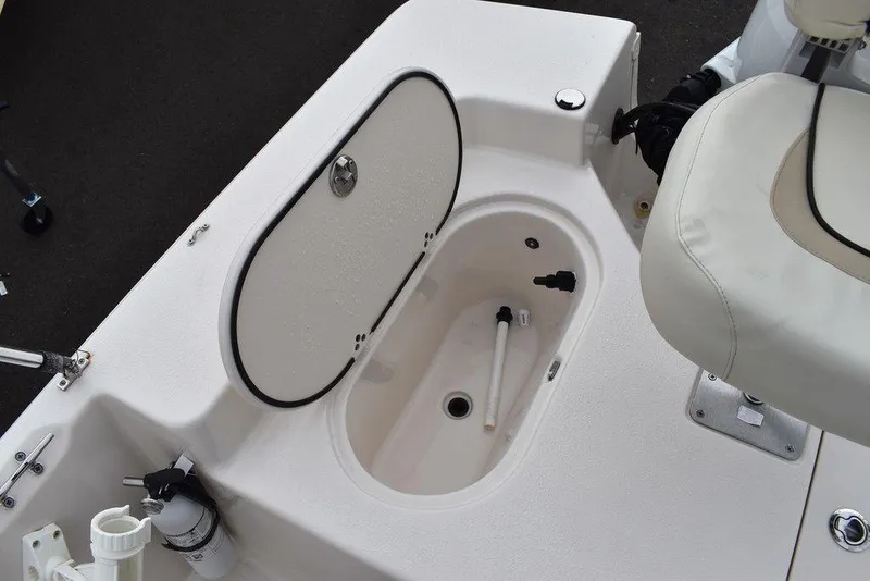 Slide: The Image of 2023 Carolina Skiff 178 JLS boat interior with open storage compartment. - 22