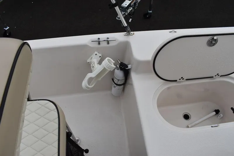 Slide: The Image of 2023 Carolina Skiff 178 JLS boat interior with rod holder and storage compartments. - 23