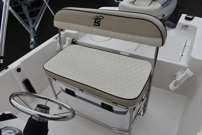 Slide: The Image of 2023 Carolina Skiff 178 JLS boat interior with cushioned seating and steering wheel. - 24