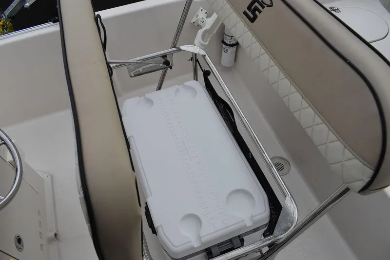 Slide: The Image of 2023 Carolina Skiff 178 JLS boat interior with cooler storage under seat. - 25