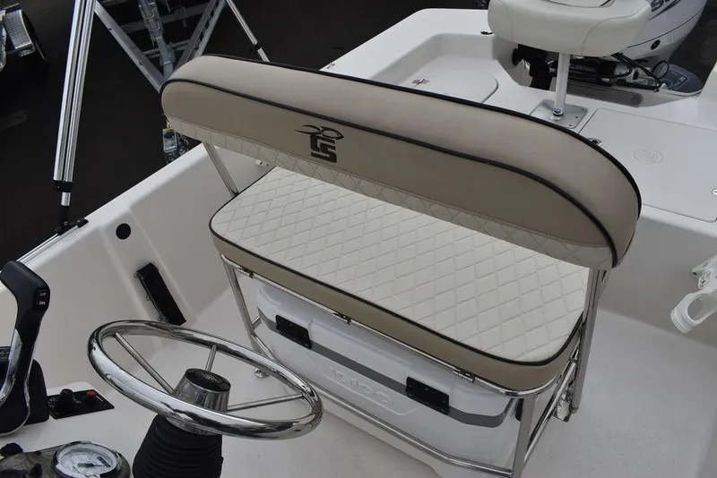 Slide: The Image of 2023 Carolina Skiff 178 JLS boat interior with cushioned seating and steering wheel. - 28