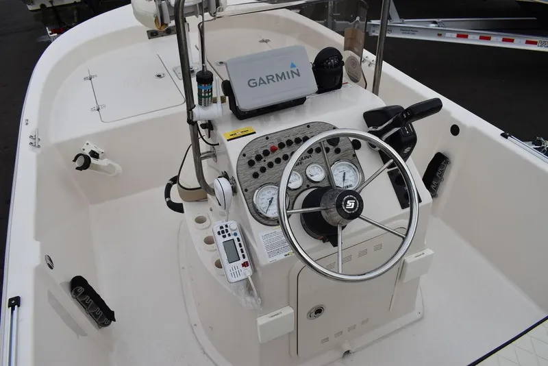 Slide: The Image of 2023 Carolina Skiff 178 JLS boat console with Garmin navigation system and steering wheel. - 29