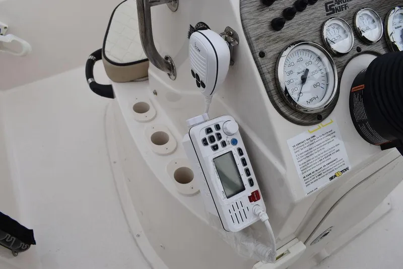Slide: The Image of Control panel of 2023 Carolina Skiff 178 JLS boat with gauges and radio. - 32