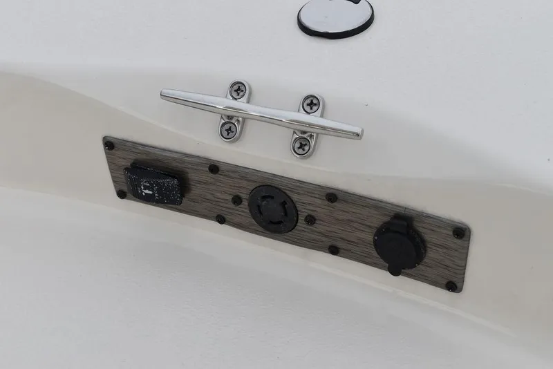Slide: The Image of Close-up of the 2023 Carolina Skiff 178 JLS boat's control panel and cleat. - 40