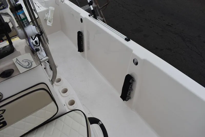 Slide: The Image of 2023 Carolina Skiff 178 JLS boat interior with seating and rod holders. - 41