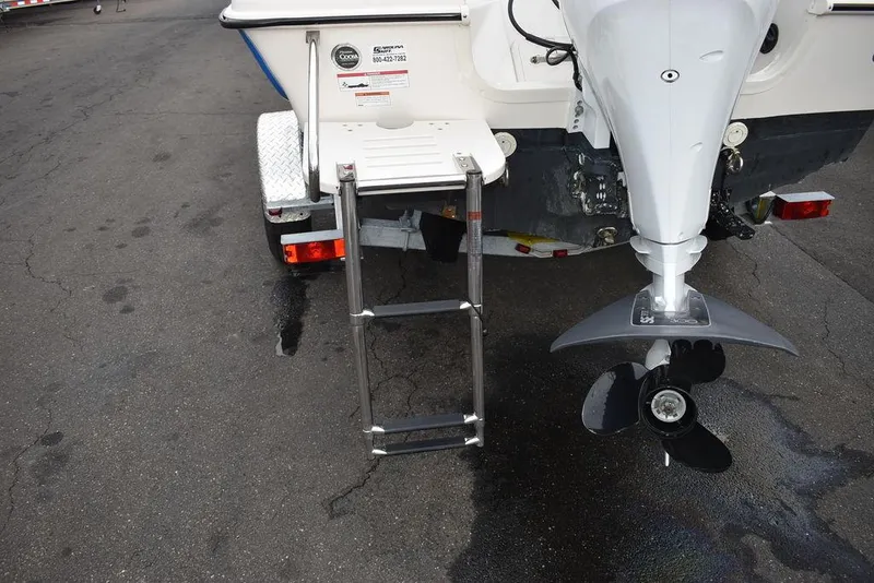 Slide: The Image of 2023 Carolina Skiff 178 JLS boat with ladder and outboard motor. - 42