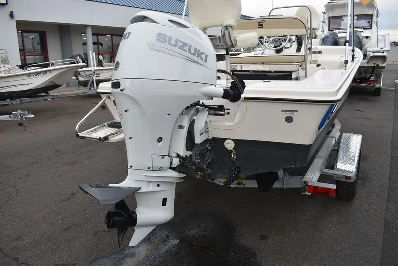 Slide: The Image of 2023 Carolina Skiff 178 JLS boat with Suzuki outboard motor on trailer. - 48