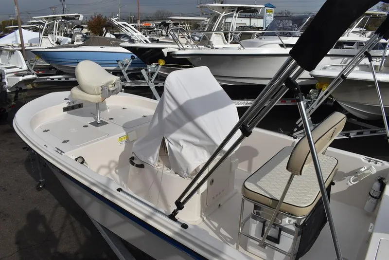 Slide: The Image of 2023 Carolina Skiff 178 JLS boat interior with seating and covered console. - 6