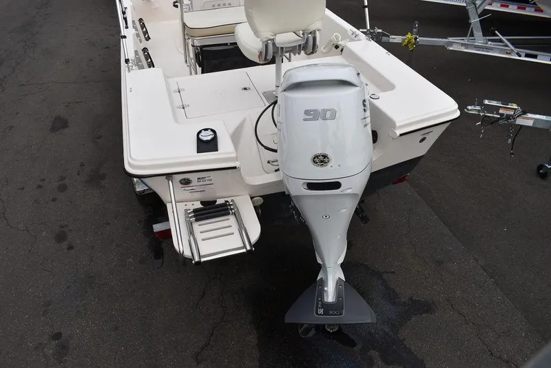 Slide: The Image of 2023 Carolina Skiff 178 JLS boat with outboard motor, rear view. - 8